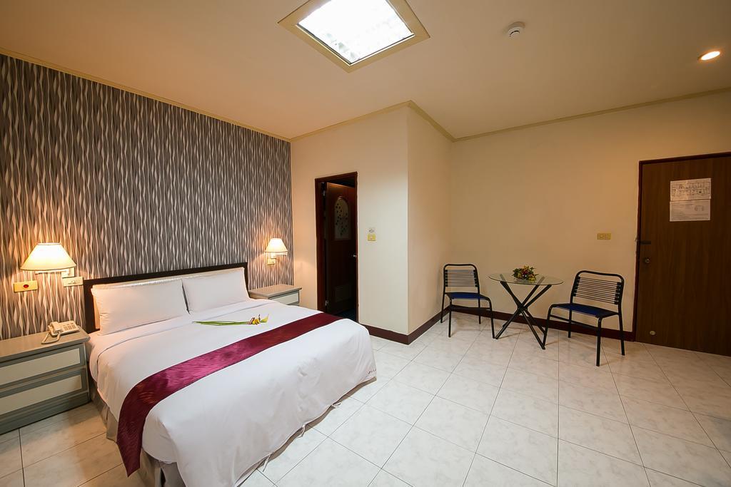 Jiuning Business Hotel Tainan Oda fotoğraf
